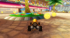 Mario Kart Wii screenshot shows coin collecting on Coconut Mall
